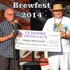 Lemoore Senior Center President Richard Rea receives a check from Lemoore Lions President Greg Martella.